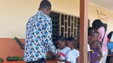 Some of the children in a queue for their meals