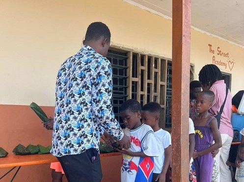 Some of the children in a queue for their meals