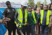 -Mr Mburidiba (third from left) about to cut the sod for work to begin. With him is Ms Tagba (third from right) and other dignitaries at the programme