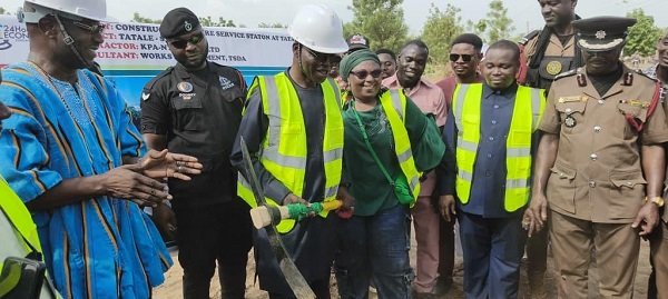 -Mr Mburidiba (third from left) about to cut the sod for work to begin. With him is Ms Tagba (third from right) and other dignitaries at the programme