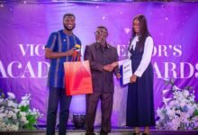 Ms Brown (right) receiving her prize at the event