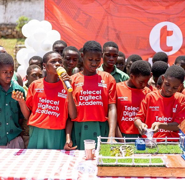 Ruth Martey explaining how the ''Smart Farm'' works at the graduation ceremony. With her are the teammates