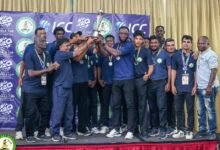 The winners celebrate with the trophy