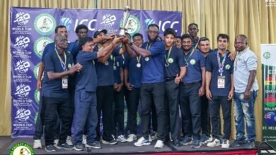 The winners celebrate with the trophy