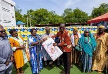 Vice President Opoku-Agyemang (third from left) presenting the sanitary pads to Dr Josephat Ana-Imwine Nyuzaghl, Upper West Regional Director of Health,