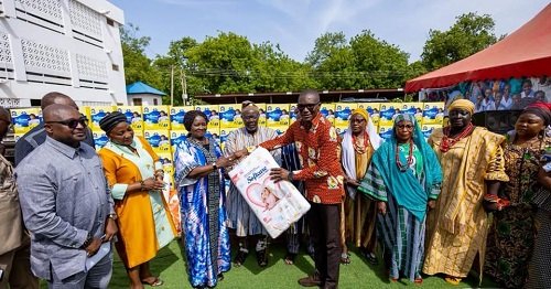 Vice President Opoku-Agyemang (third from left) presenting the sanitary pads to Dr Josephat Ana-Imwine Nyuzaghl, Upper West Regional Director of Health,