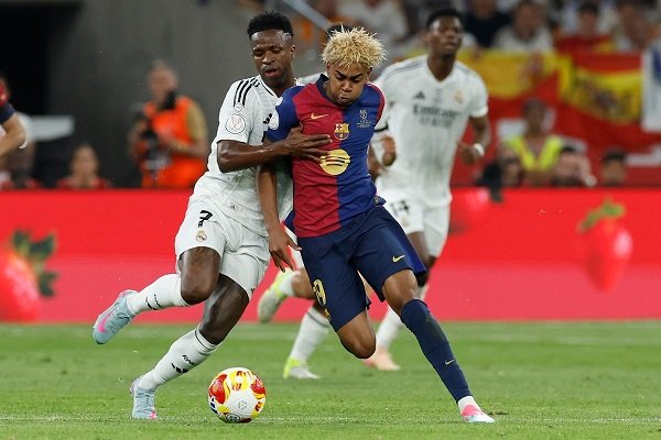 Vini Jr (left) and Lamine Yamal in a tussle for the ball during a recent