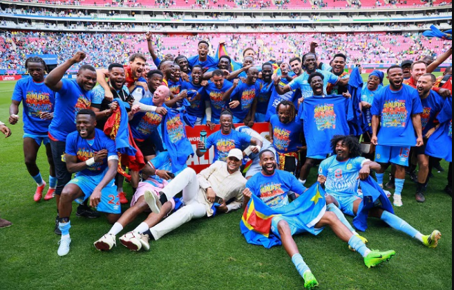 • DR Congo's players celebrate qualifying for the FIFA World Cup