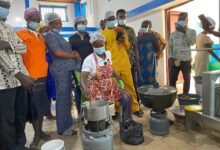 Ms Kate Obour (seated) taking farmers through the process of preparing cashew jam