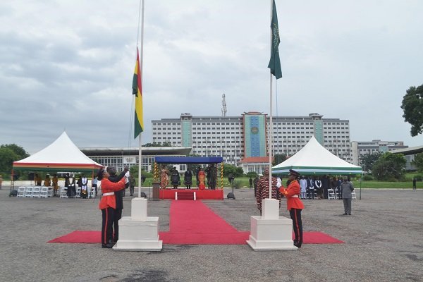 Mr Quayson (left) and Mr Chinoze hoisting the flags during the AU flag raising celebration day Photo Victor A. Buxton