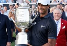 Aaron Rai holds the Wanamaker Trophy after winning the PGA Championship.