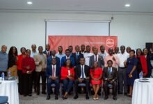 Absa bank officials with the participants after the event