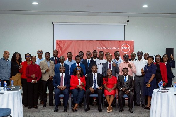 Absa bank officials with the participants after the event