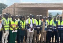 Mr Agbodza (middle) with some contractors and consultants at Bunso project site