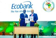 Mr Mene (right) and Mr Larbie exchanging the signed document