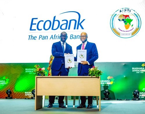 Mr Mene (right) and Mr Larbie exchanging the signed document