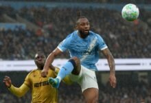Antoine Semenyo challenges for the ball with Palace's Jaydee Canvot during the game