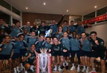 Arsenal’s squad celebrating with a replica trophy