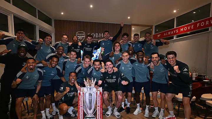 Arsenal’s squad celebrating with a replica trophy