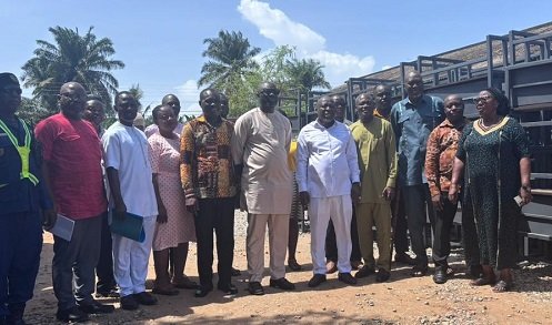 Mr Jamal (seventh from left) with officials of the Assembly after the donation