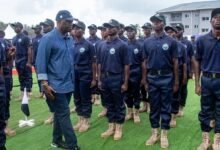 -Mr Armah-Kofi Buah inspecting the parade of the Blue Water Guards at the graduation ceremony