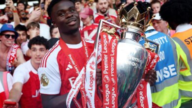Bukayo Saka with the EPL trophy
