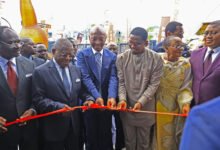 Dr Motsepe (middle) join by Samuel Eto’o (right) and Dion Ngute