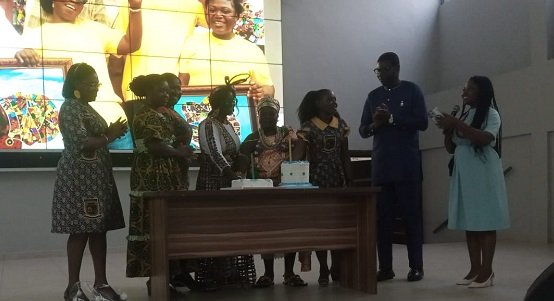 Dr Okai-Mensah (middle), together with other dignatries, cutting the anniversary cake.