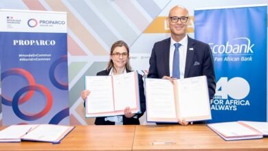 Ms Lombard (left) and Mr Awori displaying the signed documents