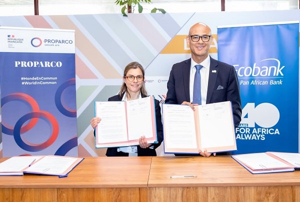 Ms Lombard (left) and Mr Awori displaying the signed documents