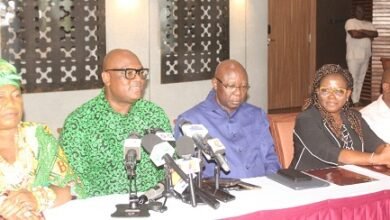 Mr Madjie (second from left) addressing the press. With him include Mr Oppong-Fosu (third from right), Board Chairman, GIPC