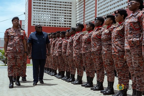 Mr Debrah (middle) inspecting the guard of honour at the parade