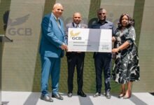 Prof. Alabi (left), Mr Alhassan (second from left), Mr Kofi Adams (second from right) and Mrs. Asamoah displaying the dummy cheque after the donation .JPG