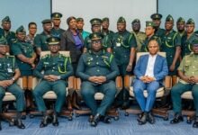 Mr Disu (seated middle) with GIS officers after the training programme