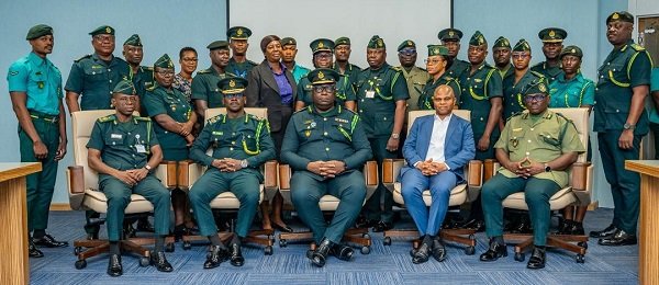 Mr Disu (seated middle) with GIS officers after the training programme