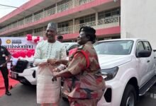 Mr Mohammed-Mubarak (left) handing over the keys of the vehicles to Chief Fire Officer, Sarpong