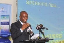 Mr Ampem (inset) addressing participants at the launch