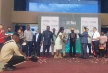 Mr Akmermer (fourth from right) and Okyeame Kwame (fifth from right) after cutting the tape to open the Annual Science and Makers’ Fair
