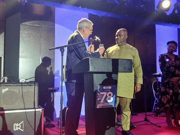 Mr Gilad (left), proposing a toast with Mr Adjei (right) at the event