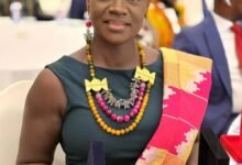 Ms Agnes Opoku Sarpong displaying her Awards