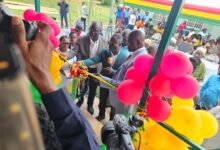 Mr Akandoh (middle) being assist by Alhaji Faila (left) to inaugurate the facility