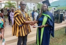 Mr Sulemana (left) presenting a citation to one of the graduates