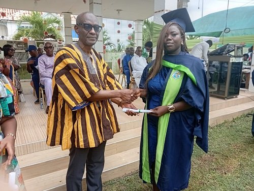 Mr Sulemana (left) presenting a citation to one of the graduates