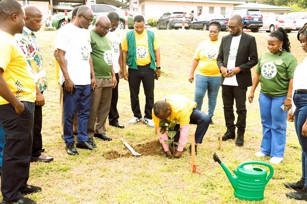 Dr Mbroh planting a flower to mark the occasion at the hospital