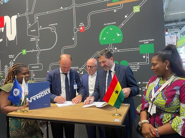 Mr Said (right) and Mr Vyncke signing the partnership agreement