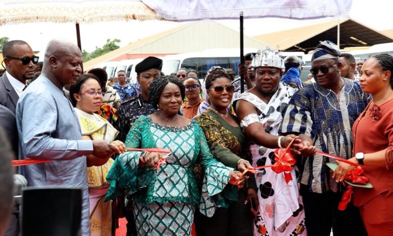 • Vice President Opoku-Agyemang (third from left) cutting the tape to inaugurate the new MMT buses. With her is Mr Joseph Bukari Nikpe, Transport Minister (left) and other dignitaries