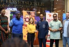 Mr McBarnett (third from right) exchanging pleasantries with Ms Sonya Sadhwani at the launch of the digital loyalty programme