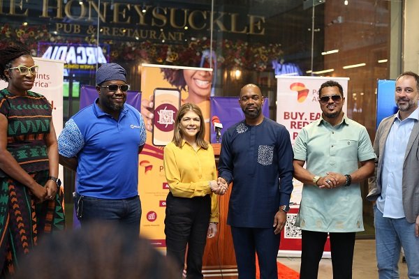 Mr McBarnett (third from right) exchanging pleasantries with Ms Sonya Sadhwani at the launch of the digital loyalty programme