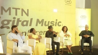 Mr Simons (middle) with other speakers at the programme