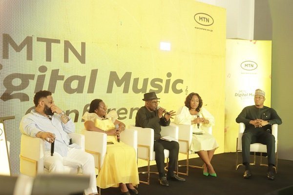 Mr Simons (middle) with other speakers at the programme